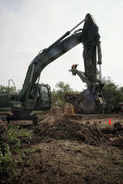 188th Engineer Company removing trees with an excavator