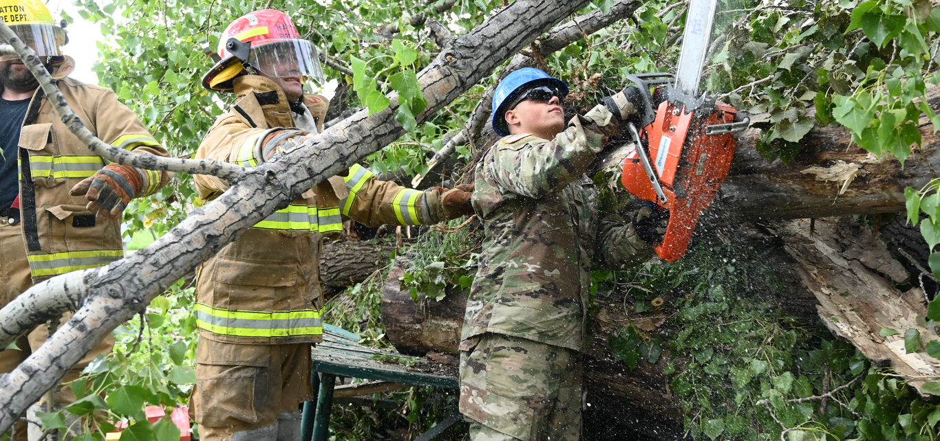 Pvt. Seth Horn, of the 188th Engineer Company, uses a chainsaw to remove branch limbs that are blocking rescue access to a simulated victim during Exercise Vigilant Guard at Golden Lake, N.D., Aug. 5, 2020. (Air National Guard photo by Chief Master Sgt. David H. Lipp)