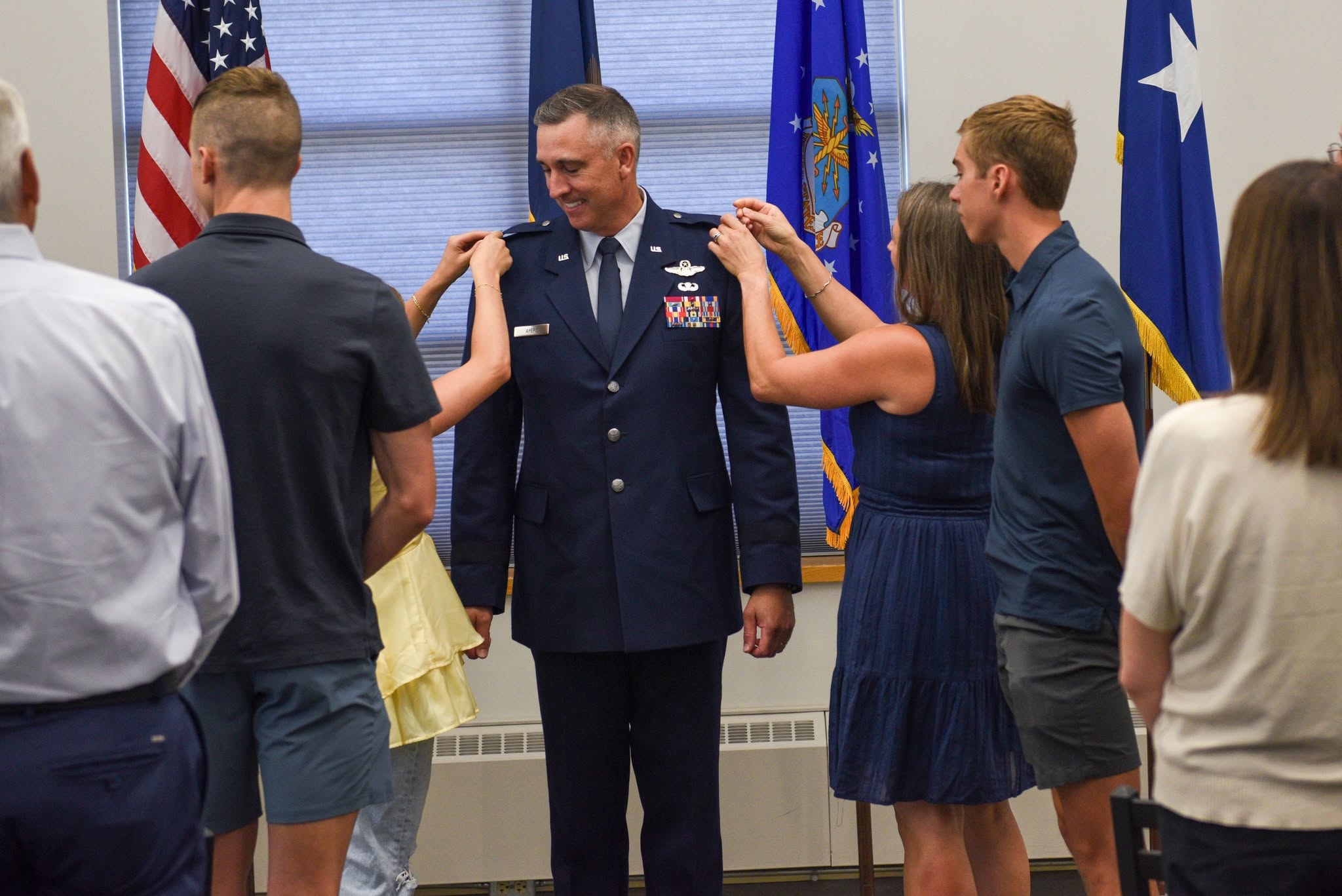 Brig. Gen. Ryan Ayers is pinned to Brig. Gen. in a ceremony on Hector Air National Guard Base