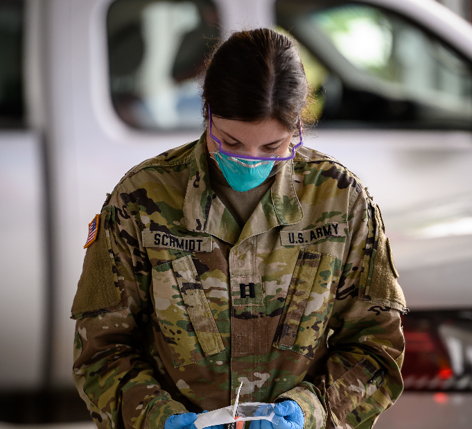 Cpt. Laura Schmidt, survey team leader for the 81st Civil Support Team, prepares Covid-19 testing kits at the COVID-19 mobile testing site inside the Fire Hall in New Town, N.D. on July 13, 2020. (U.S. Army National Guard photo by Sgt. 1st Class Brett Miller, 116th Public Affairs Detachment/Released)