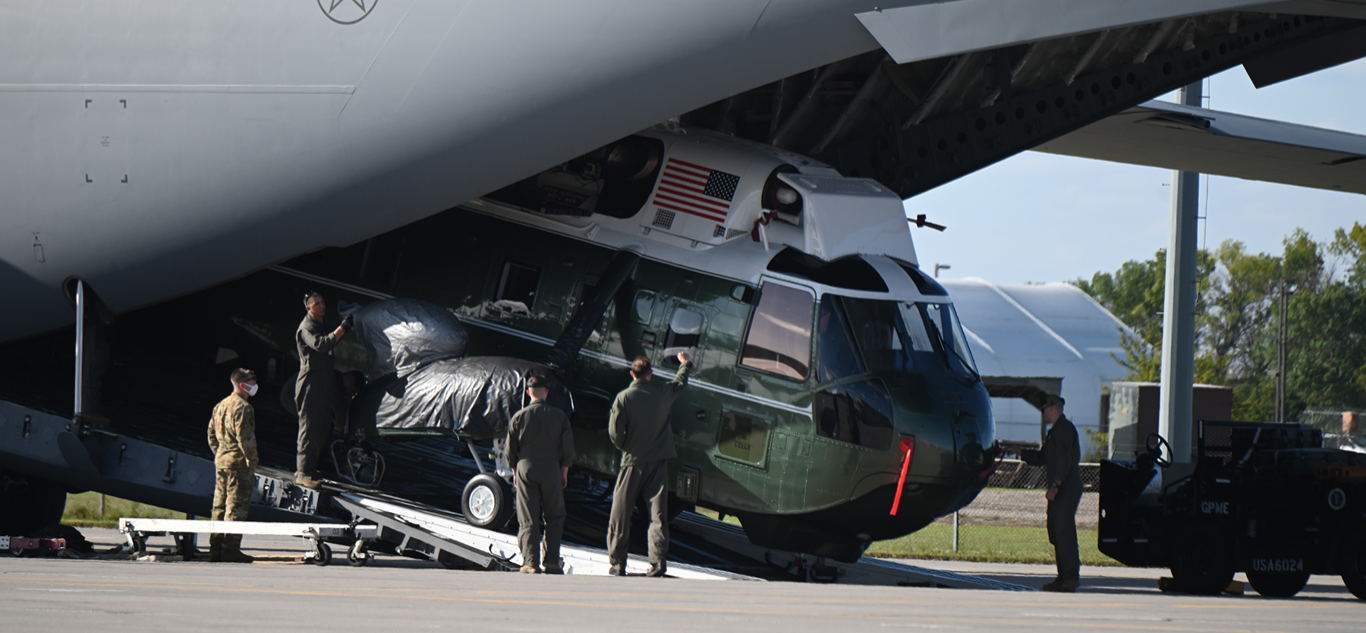 A Sikorsky VH-3D Sea King helicopter is unloaded from a C-17 Globemaster at the N.D. Air National Guard base in Fargo. Fun fact, any rotary aircraft transporting the President is assigned the call-sign of 'Marine One'.