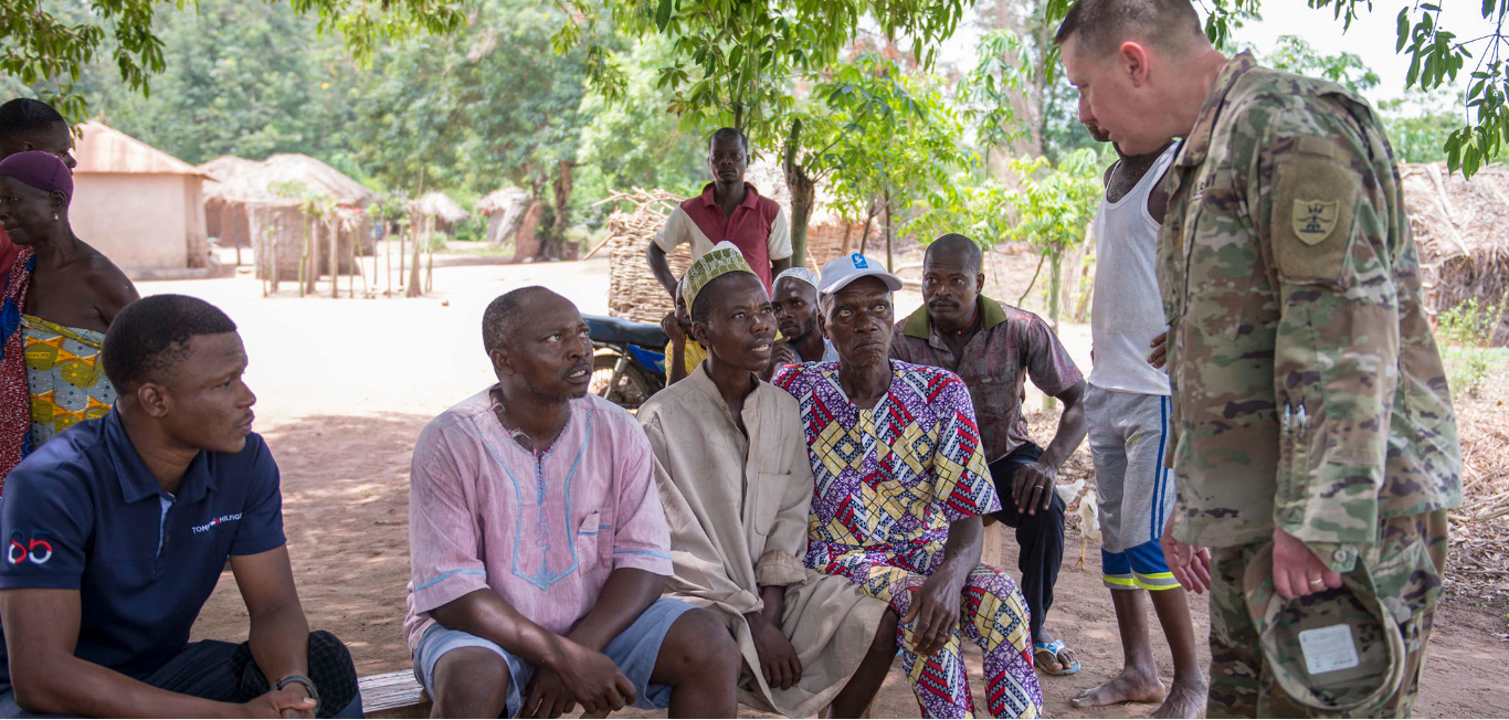 Maj. Shawn Markovic, 68th Troop Command, meets with village elders in the Kossi Kope region of Togo on March 20, 2019. The purpose of the meeting was to inform them of a first responder flood exercise occurring near their village the following day. U.S. Army National Guard photo by Spc. Thea Jorgensen, 116th Public Affairs Detachment)