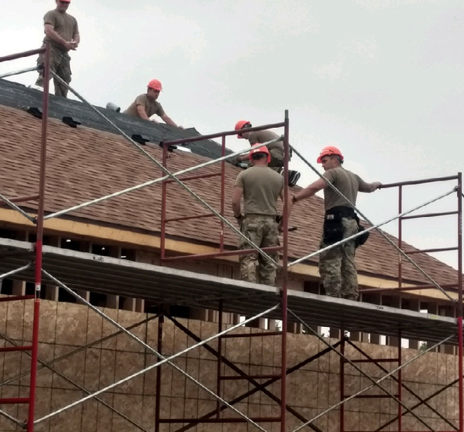 Non-commissioned officer students of the 12H30 Advanced Leader course (vertical construction supervisor) are shingling an eight-plex building scheduled to be used as basic officer quarters. All students in class 008-20 (16 Soldiers) tested negative for COVID-19. (National Guard photo by Sgt. 1st Class Dave Webber, 164th Regional Training Institute).