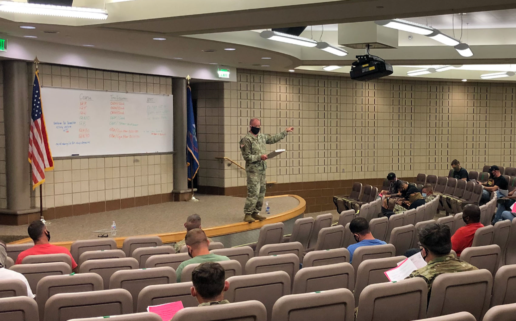 1st Sgt. Brad Bergeron briefs incoming students in the RTI theater on July 6, 2020. The students from across the Army force structure were enrolled in various classes at the RTI-ND. The students were socially distanced in accordance to CDC and the N.D. Department of Health's guidelines and all are tested for COVID-19 before beginning classes. (National Guard photo by Maj. Chance Schaffner, 164th Regional Training Institute)